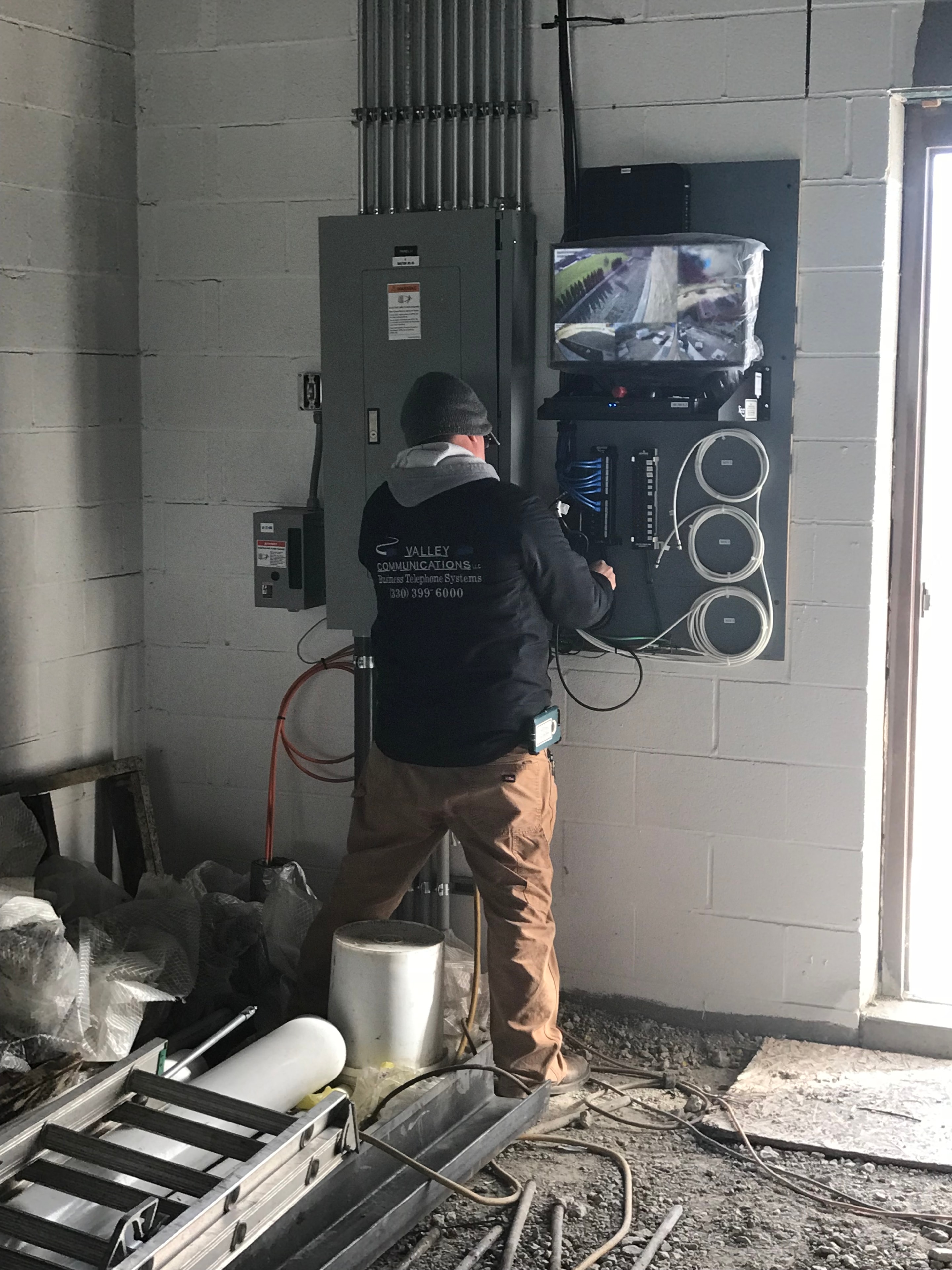 Valley Communications LLC technician Don installing CCTV system