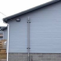 Exterior building with conduit and cabling installation